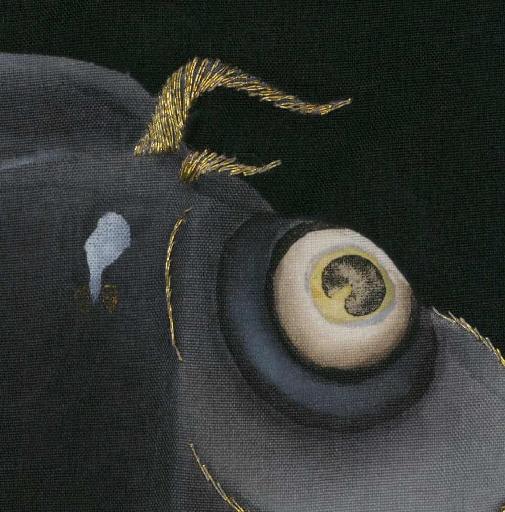 Golden threads surrounding detailed eye on textured dark background