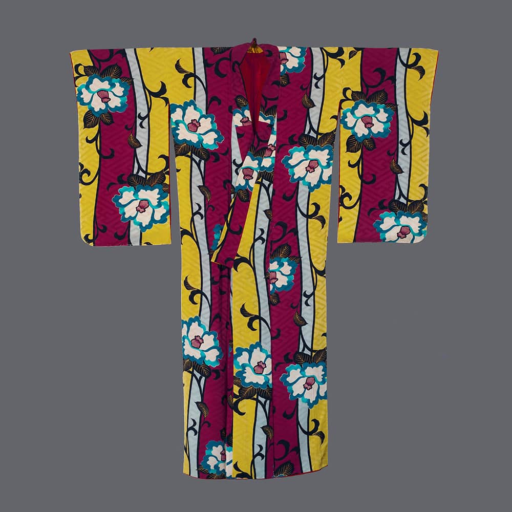 Colorful Japanese kimono with white flowers on yellow and magenta stripes