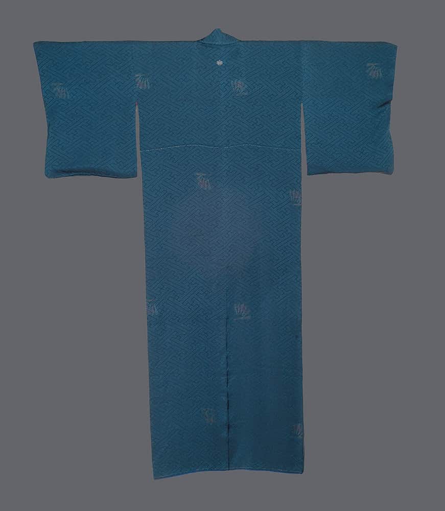 Blue traditional Japanese kimono with geometric pattern and subtle leaf motifs