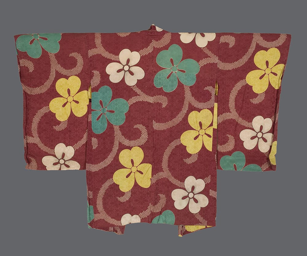 Vintage Japanese kimono with floral pattern in red, yellow, green, and white