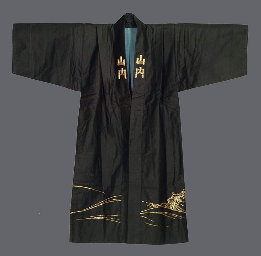 Black Japanese kimono with gold embroidered landscape and characters