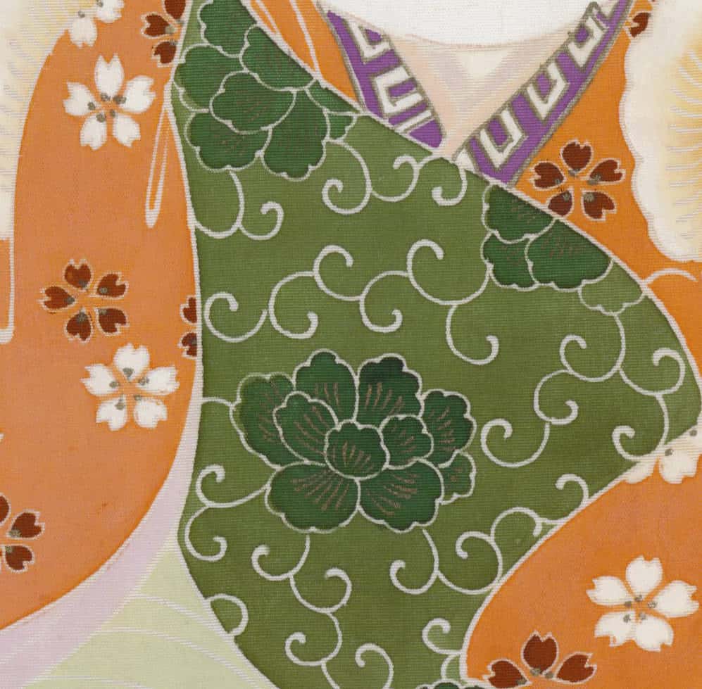 Traditional Japanese textile with floral patterns in green, orange, and white