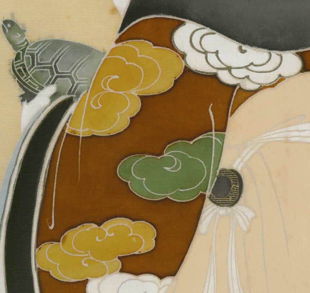 Japanese textile detail with stylized clouds, turtle, and geometric patterns