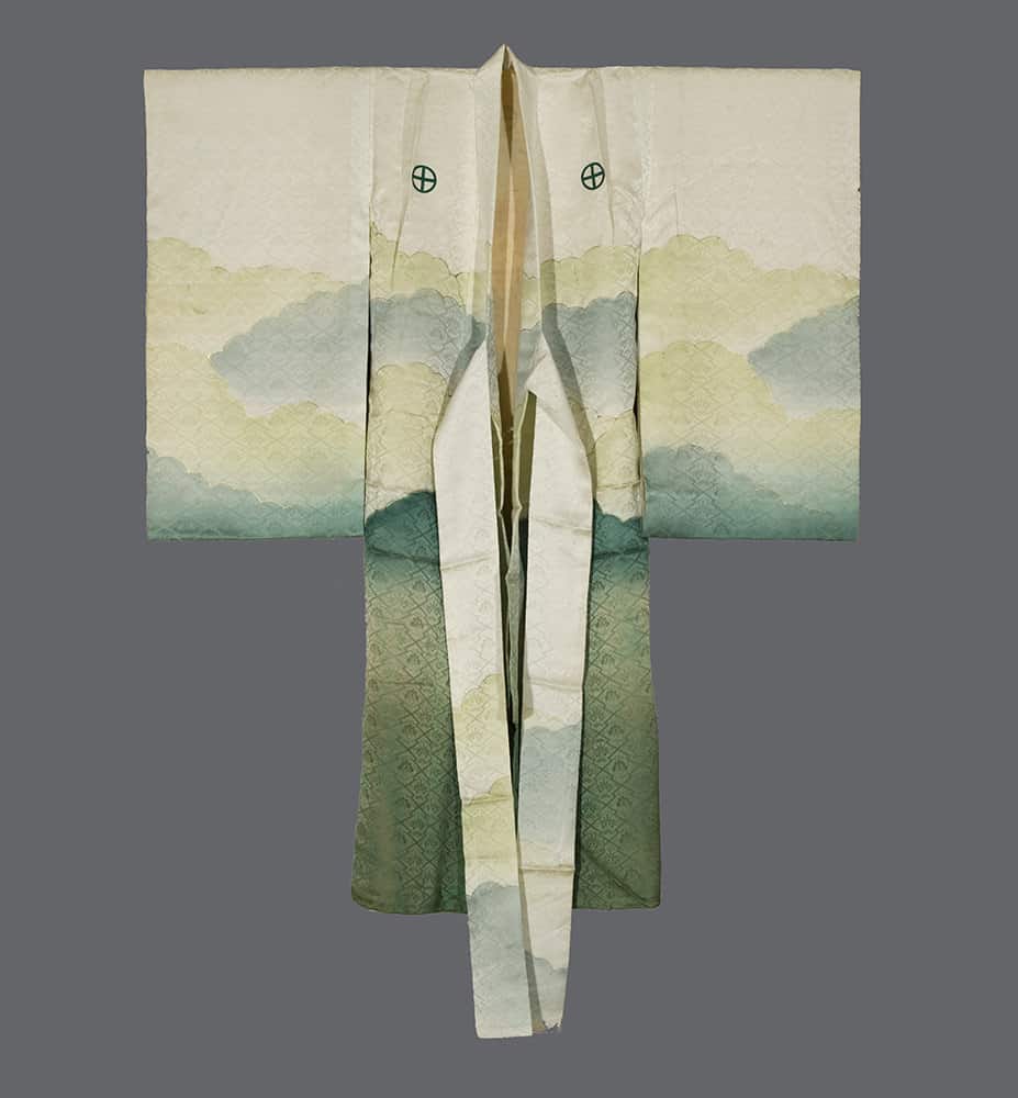 Traditional Japanese kimono with misty mountain landscape in green and white