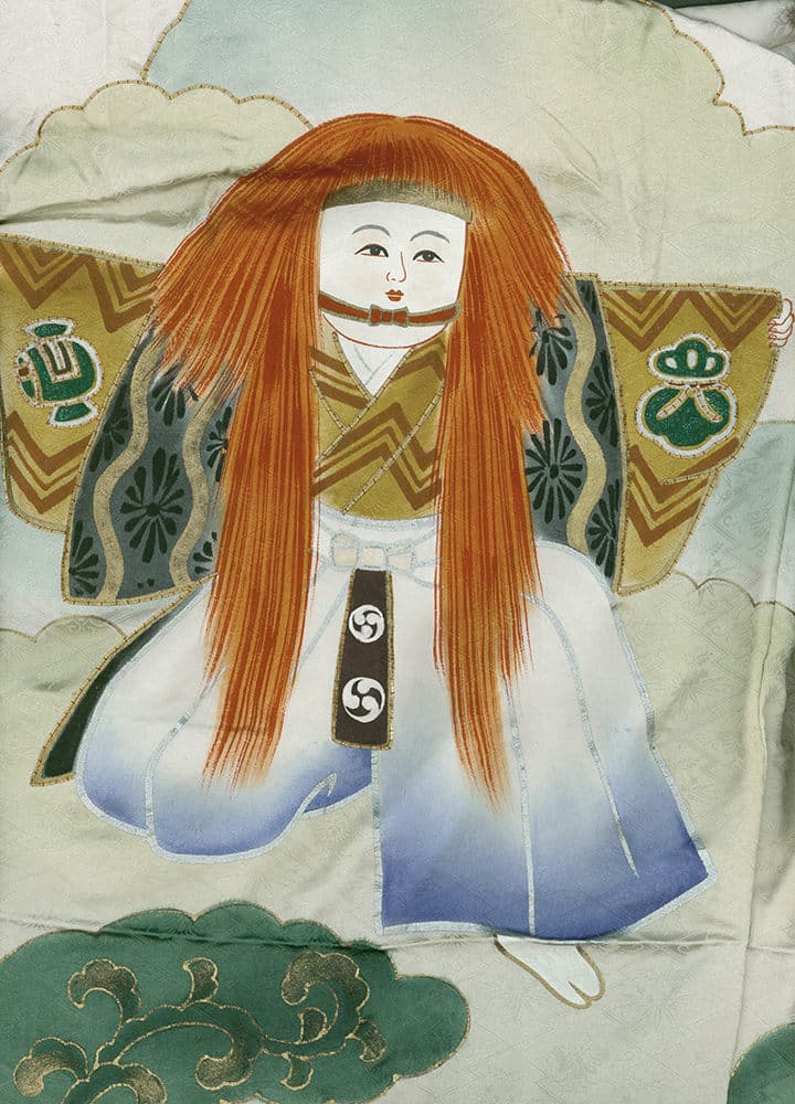 Traditional Japanese doll with vibrant orange hair in white and blue kimono
