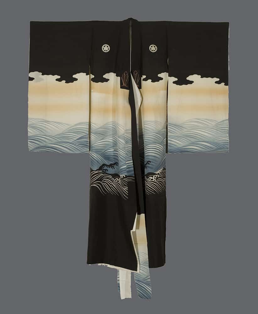 Black Japanese kimono with wave and cloud pattern against gray background