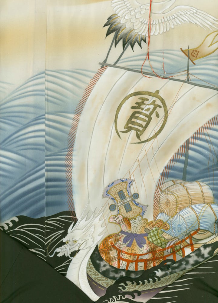 Japanese art of ship with white sail, dragon, and decorative elements