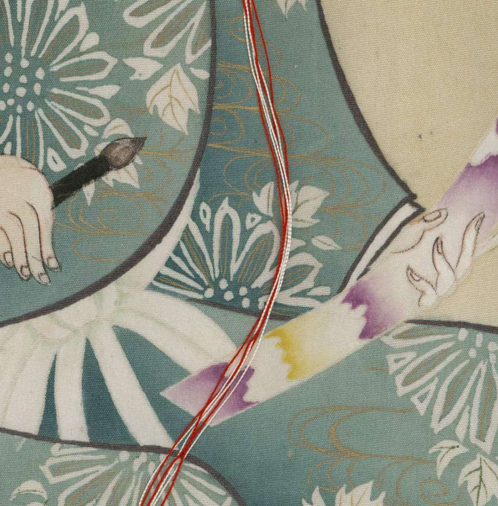 Vintage floral textile with blue-green pattern and red vertical stitching