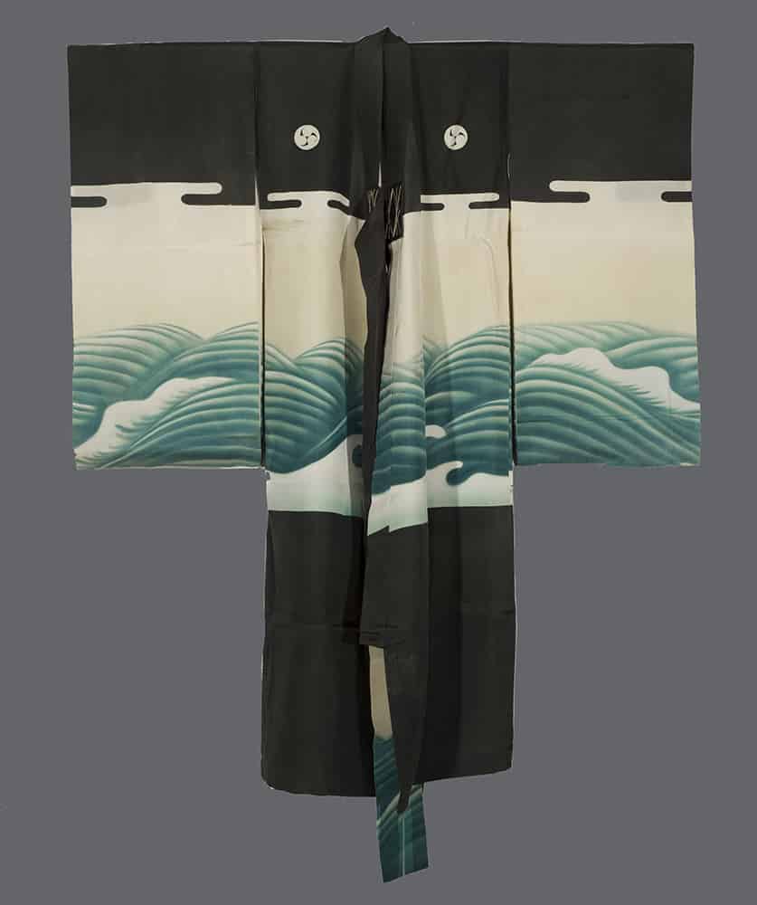 Black and white Japanese kimono with stylized green ocean wave design