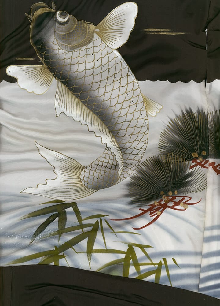 White koi fish leaping among bamboo and palm leaves in traditional artwork