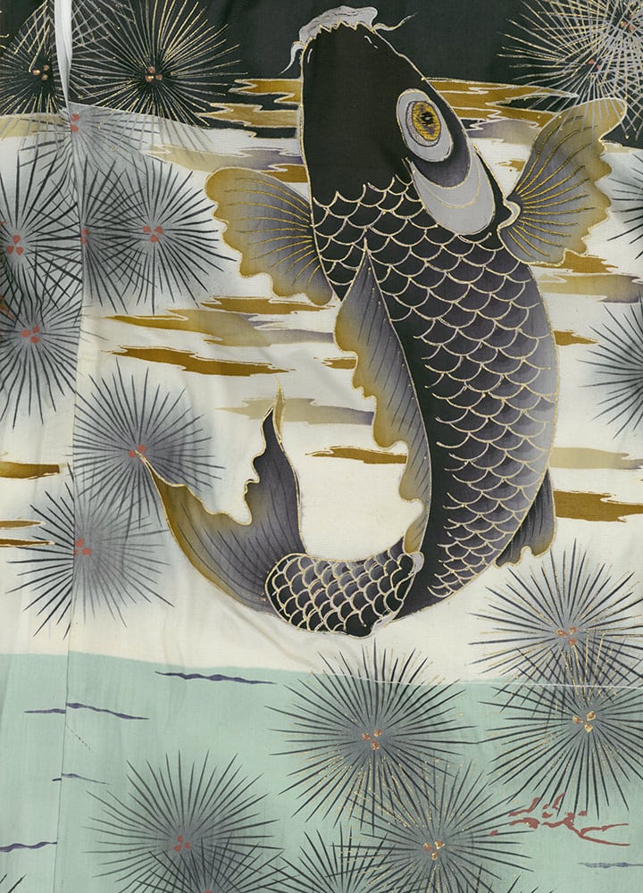 Japanese art of black and white koi fish leaping through stylized water