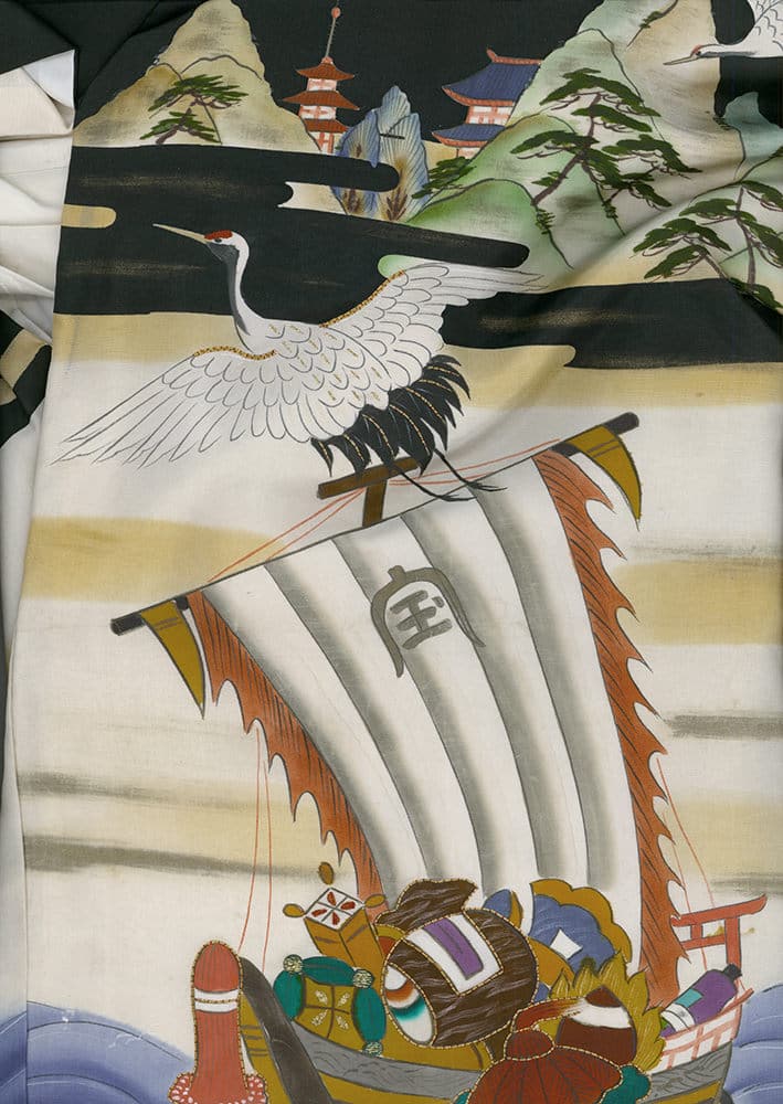 Japanese crane flying over traditional boat with pagoda landscape background