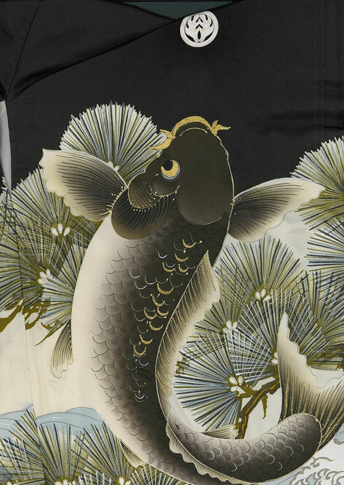 Japanese art of black and white koi fish among pine branches