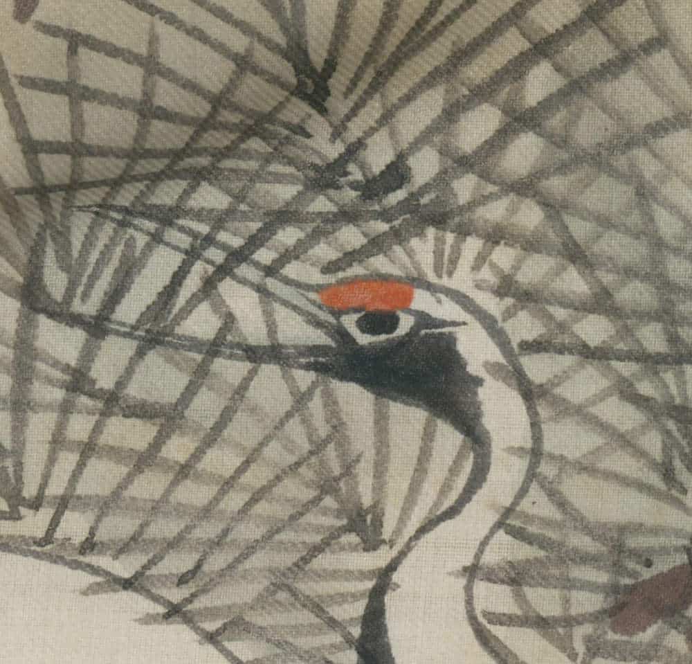 Bird with bright red crest perched amid intricate grayscale branch lines