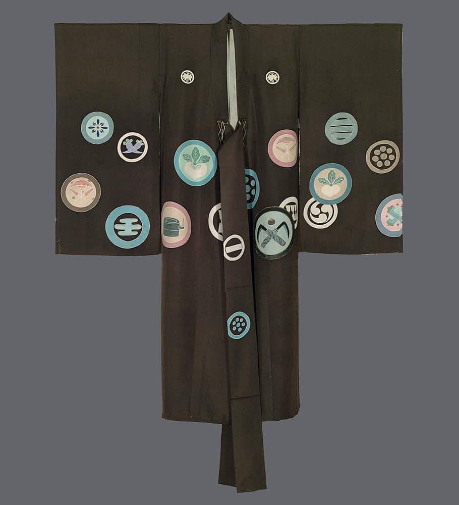 Dark Japanese kimono with colorful family crests scattered across fabric