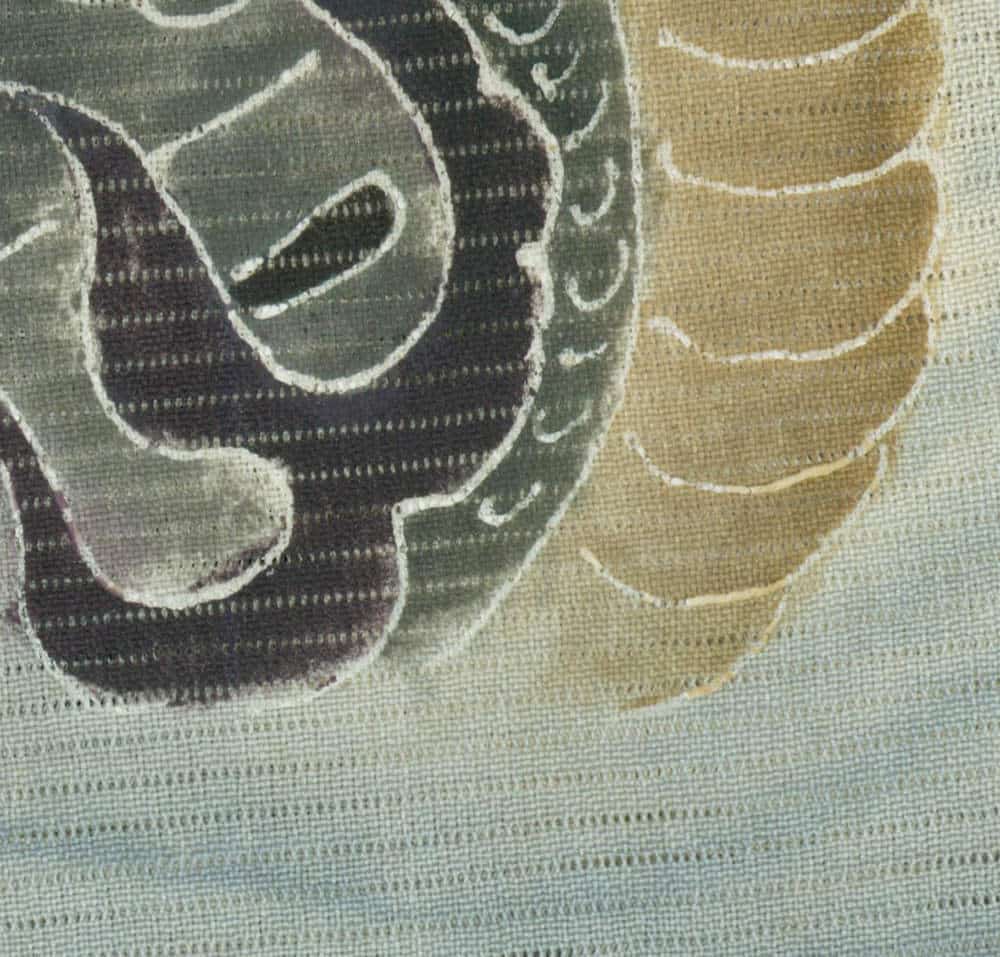 Abstract textured fabric with curved lines in green and beige tones