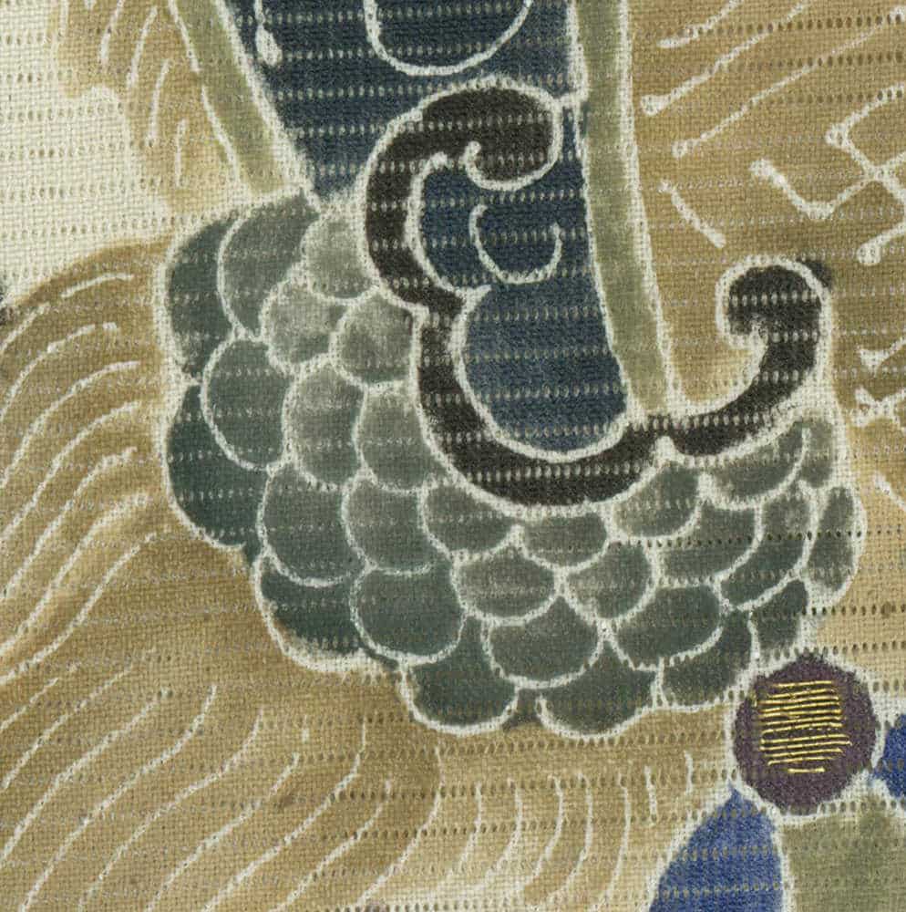 Abstract floral textile with scaled pattern in blue, green, and beige tones