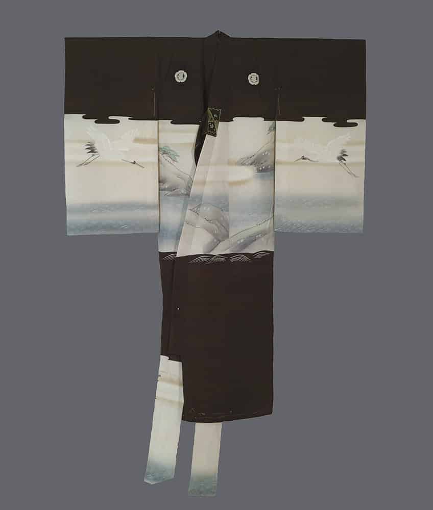 Traditional Japanese black and white kimono with crane and landscape design