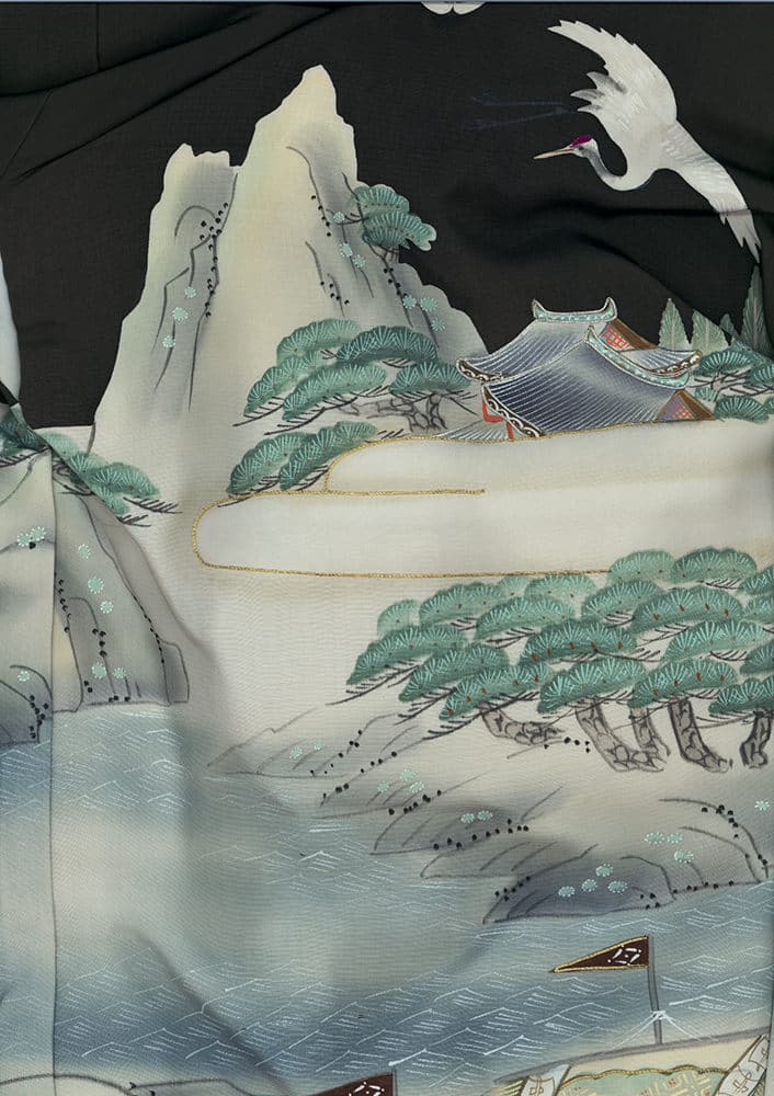 Japanese landscape with mountains, white crane, trees, and traditional building