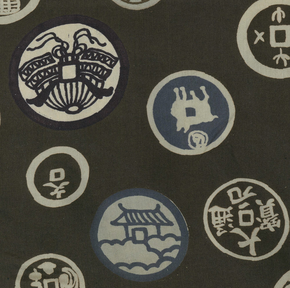 Japanese mon family crests on dark textile with circular design patterns