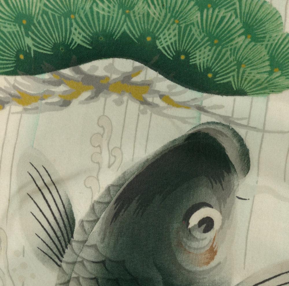 Grayscale fish with expressive eye swimming near green patterned background