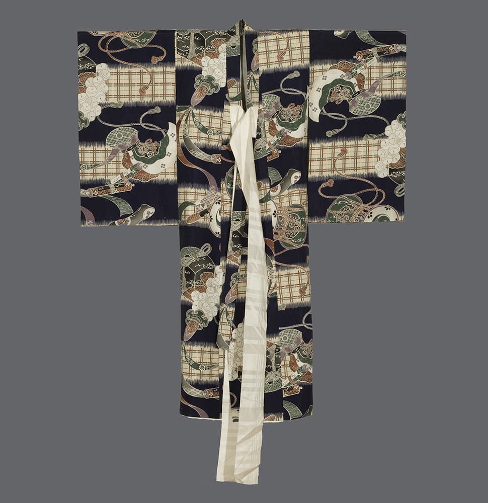 Vintage Japanese kimono with intricate pattern of geometric shapes and scrolls