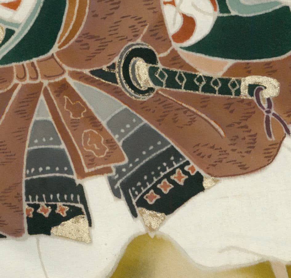 Vintage textile with geometric patterns and stylized key design