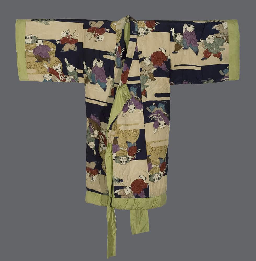 Vintage Japanese kimono with playful figures in colorful patchwork design