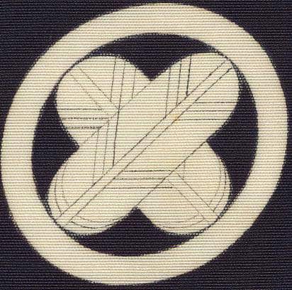 Stylized leaf or botanical symbol on textured black and cream background