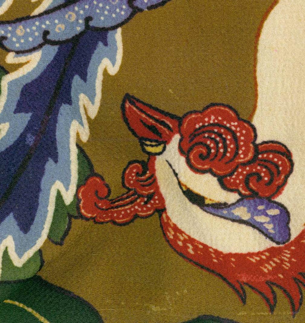 Vintage Japanese textile with stylized red bird and blue floral motif