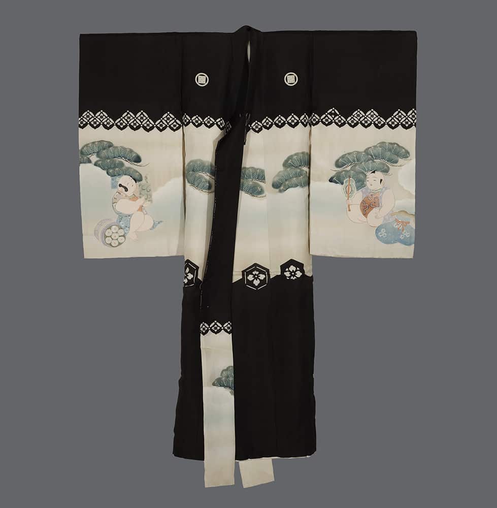 Traditional black and white Japanese kimono with playful child illustrations