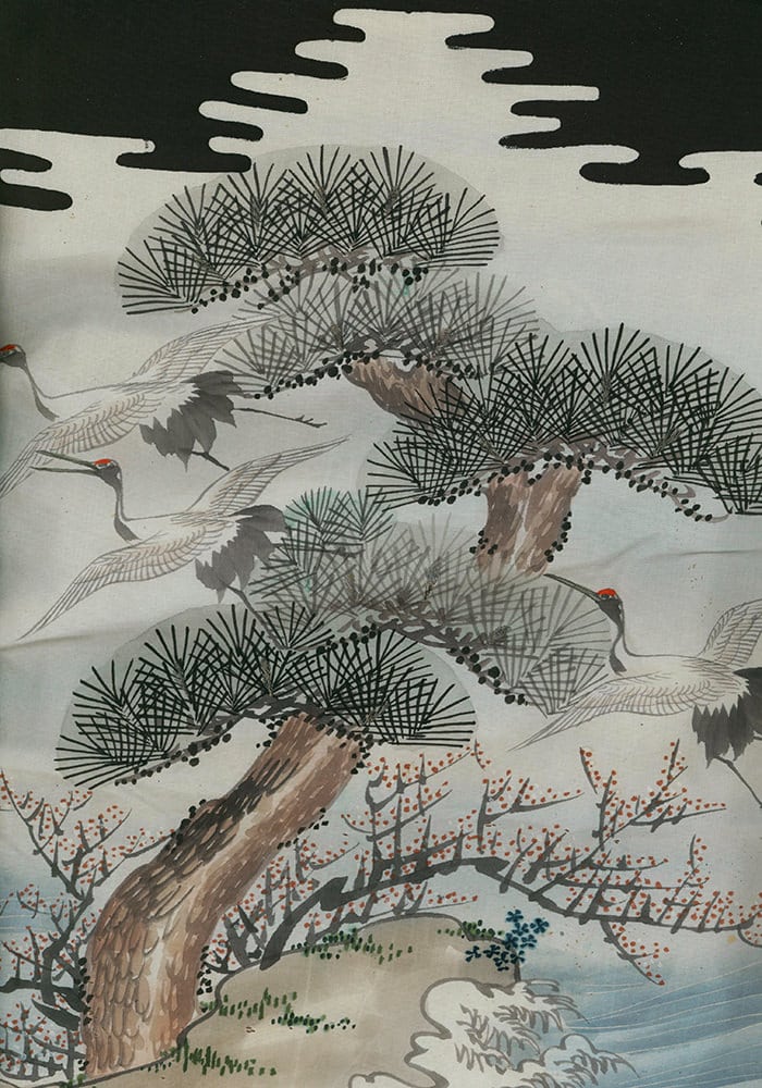 Cranes flying near pine trees and blossoming branches in Japanese artwork