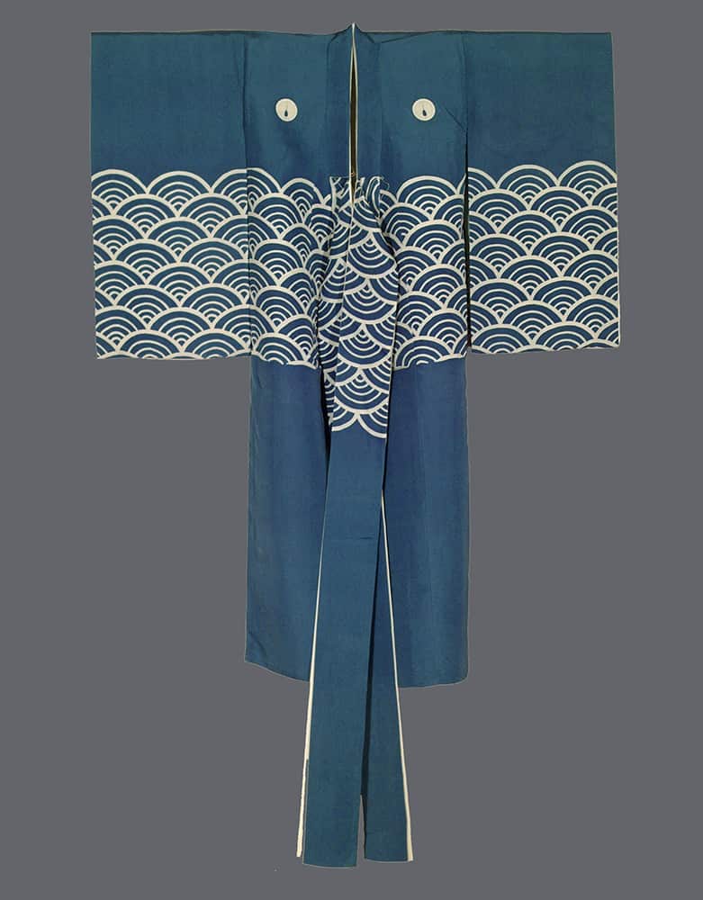 Blue Japanese kimono with white wave pattern and circular motifs