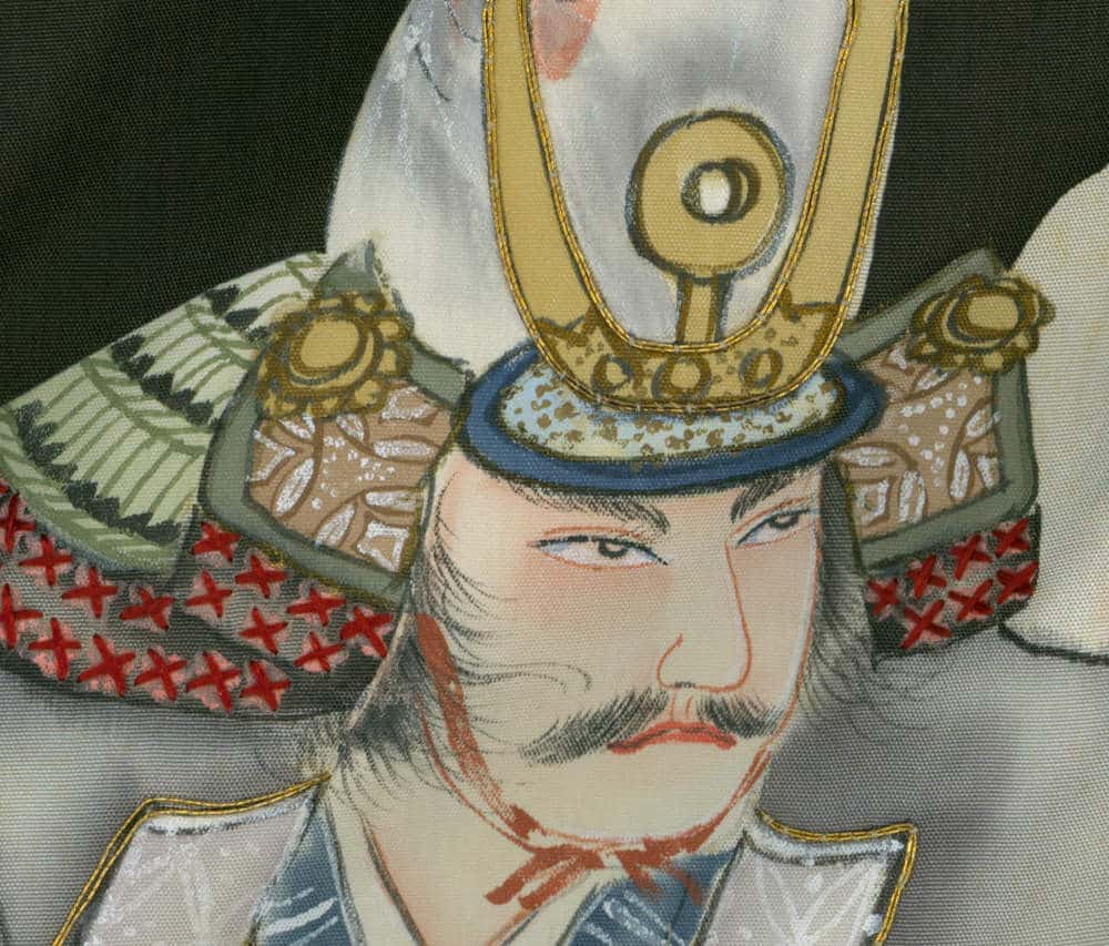 Japanese samurai warrior in ornate helmet with gold and red details