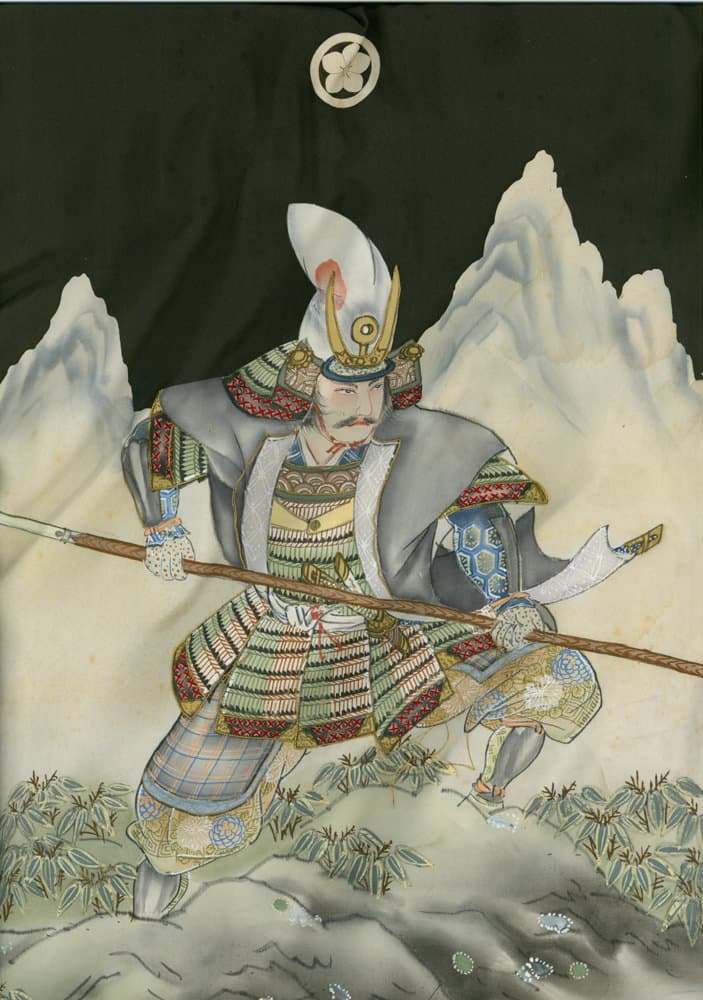 Japanese samurai warrior in ornate armor holding spear among mountains