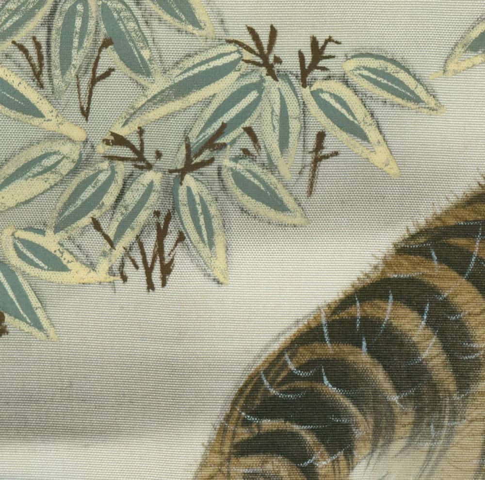 Botanical pattern with pale green leaves and tiger print fabric