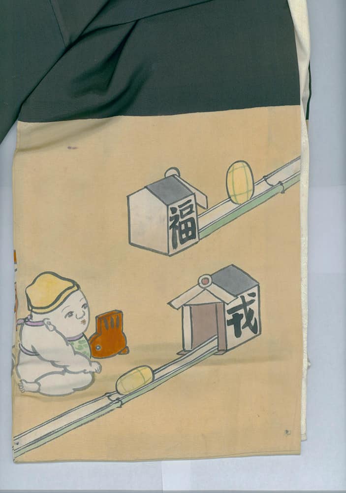 Baby sitting near vintage train with Japanese characters on buildings