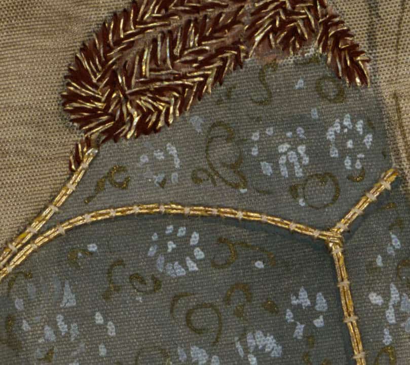 Embroidered fabric with golden thread and intricate textured design