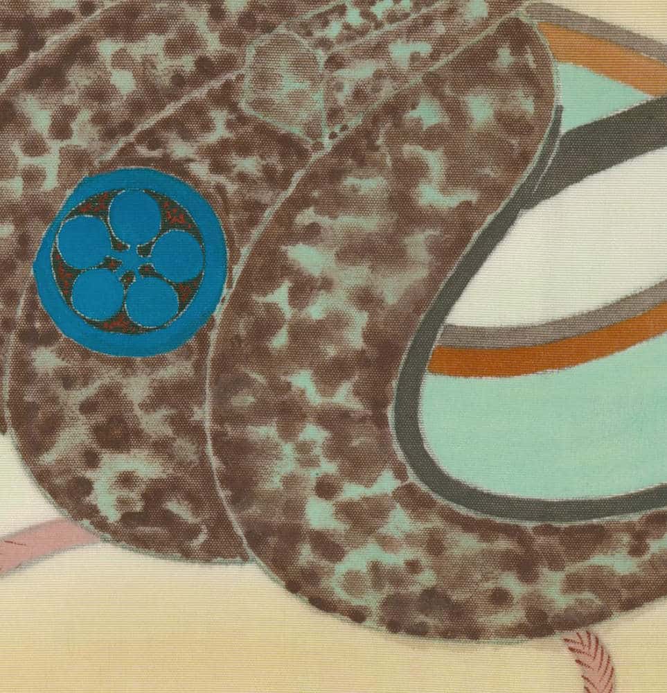 Mottled brown textured fabric with blue circular logo and geometric shapes