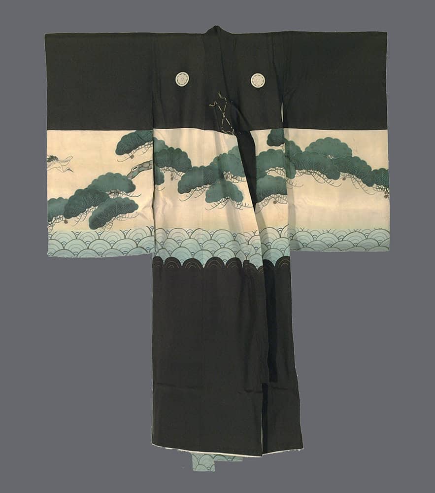 Traditional Japanese black kimono with green pine trees and wave pattern