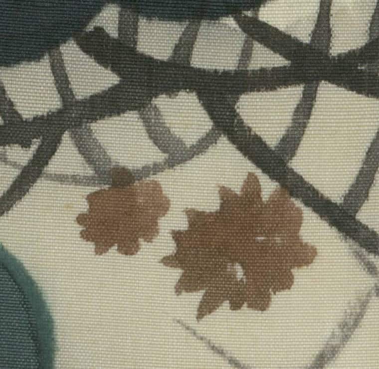 Brown autumn leaves on textured fabric with abstract geometric lines