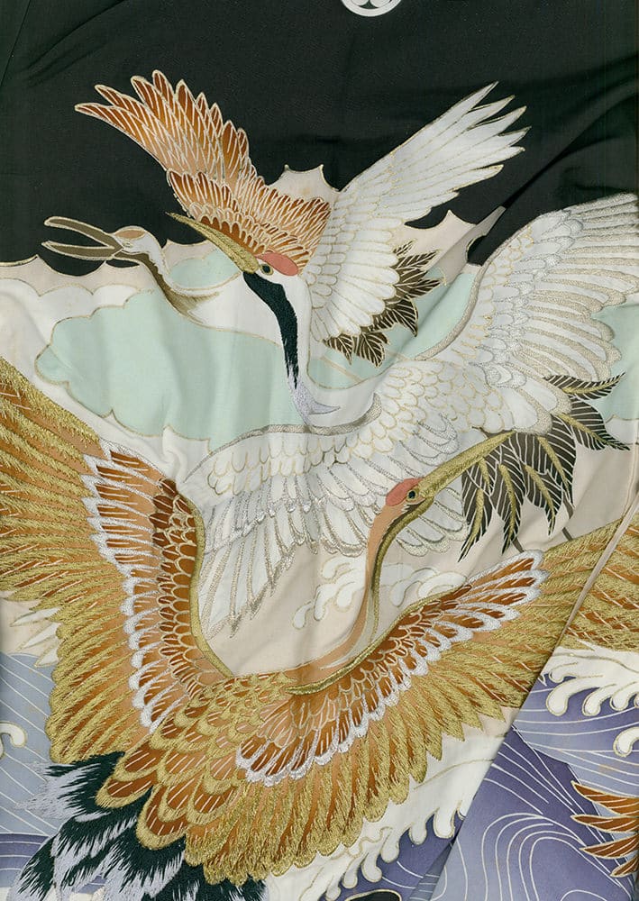 Elegant Japanese-style painting of cranes flying over cloudy sky and waves