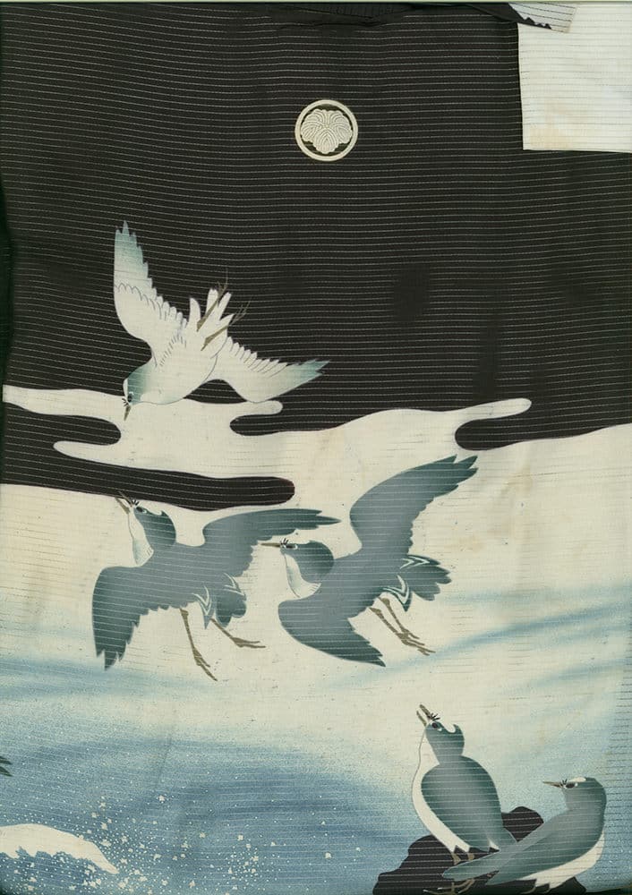 Japanese woodblock print of flying and perched cranes against misty background