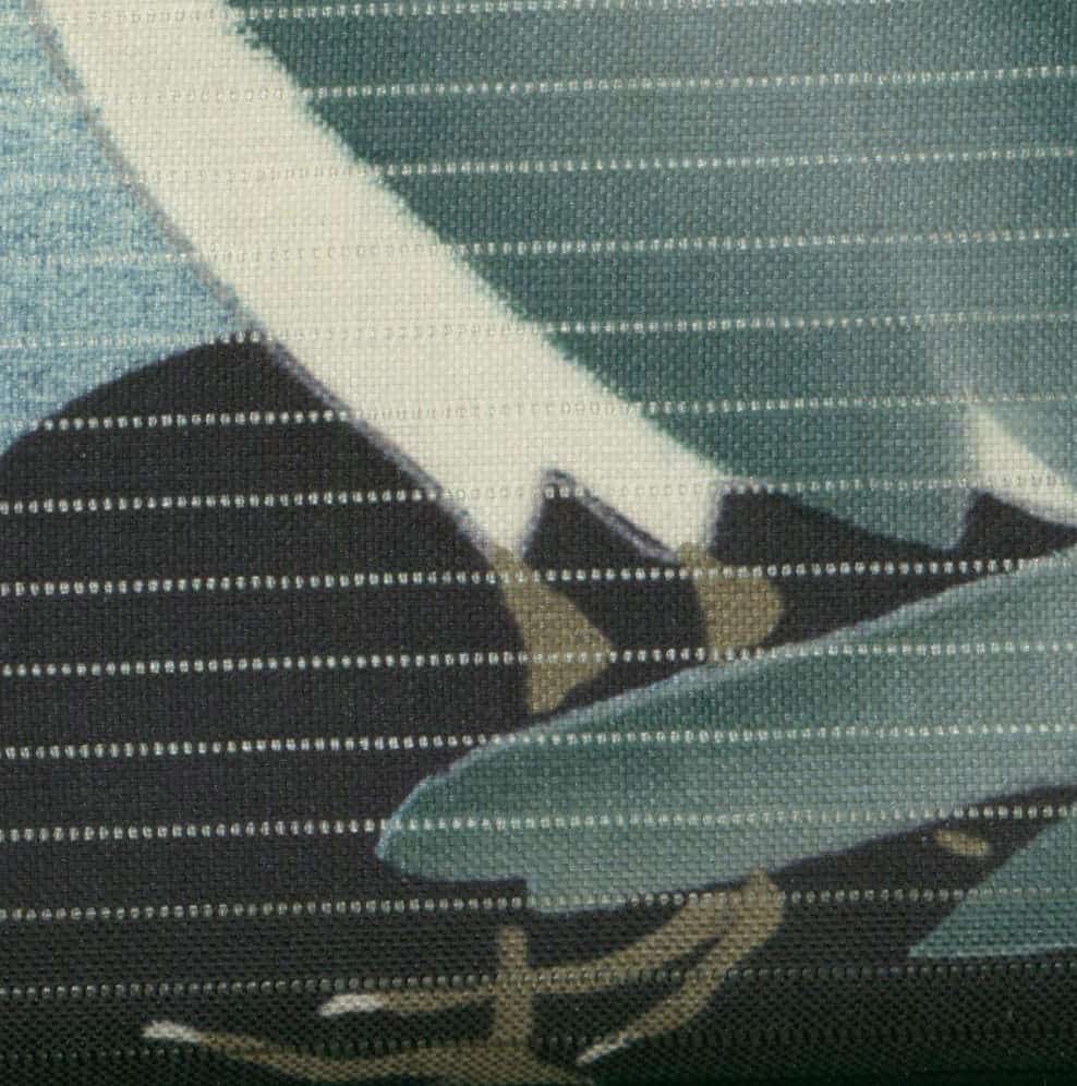 Abstract geometric textile with overlapping blue, green, and black shapes