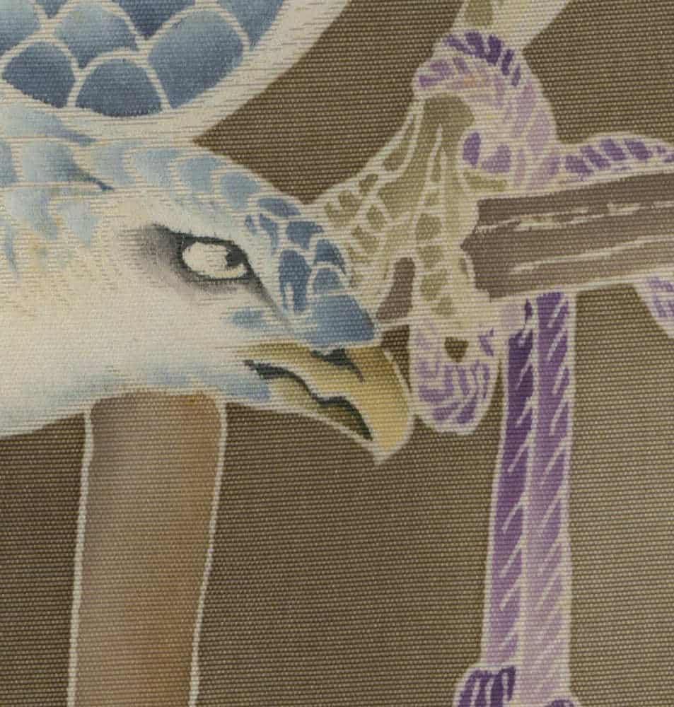 Blue and purple dragon eye closeup on textured fabric