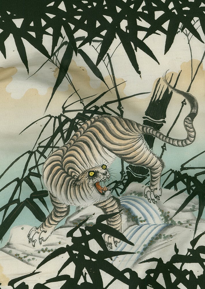 Japanese woodblock print of a fierce white tiger among bamboo leaves