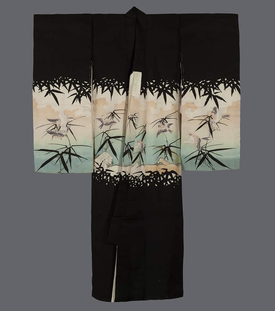 Black Japanese kimono with bamboo and bird design on pastel background