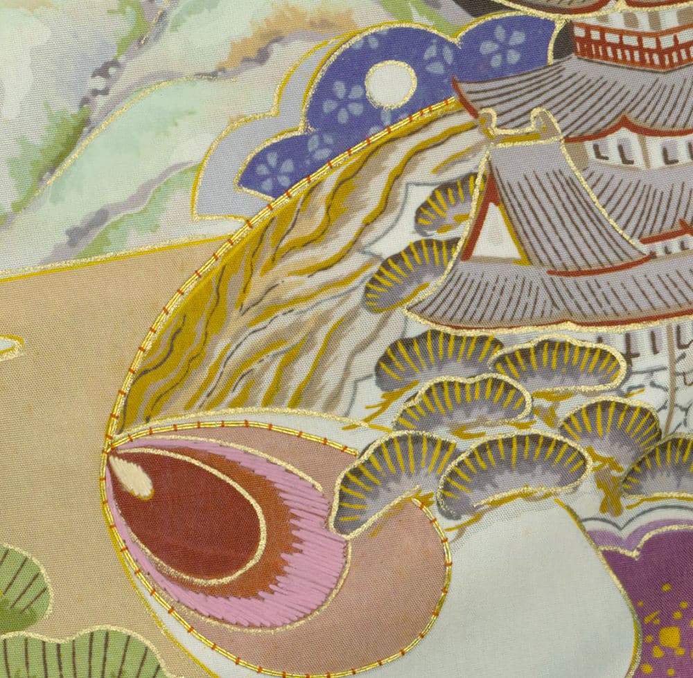 Colorful Japanese textile detail with intricate gold embroidery and stylized patterns