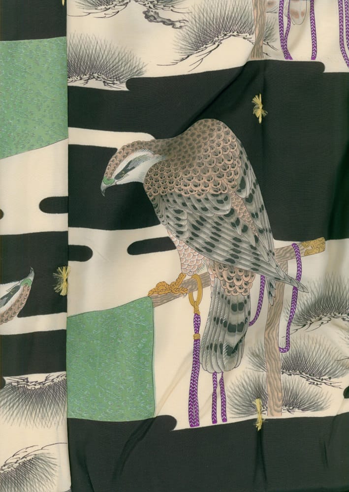 Japanese woodblock print of a falcon perched on purple cords