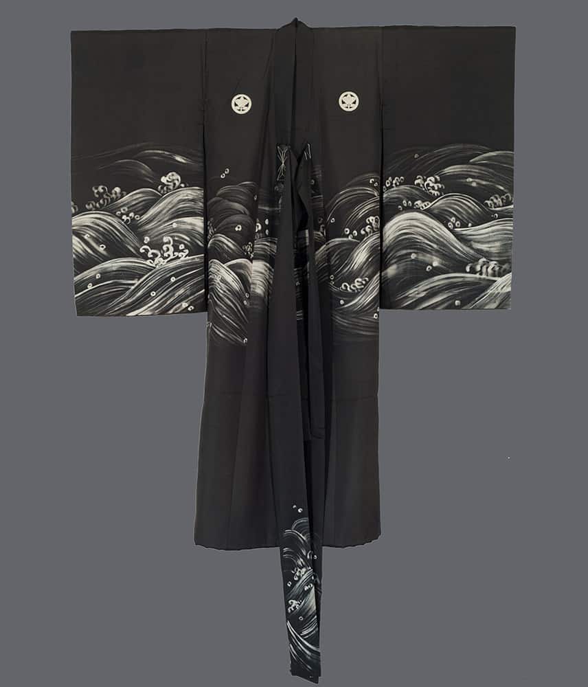 Black kimono with elegant white wave pattern and traditional family crests